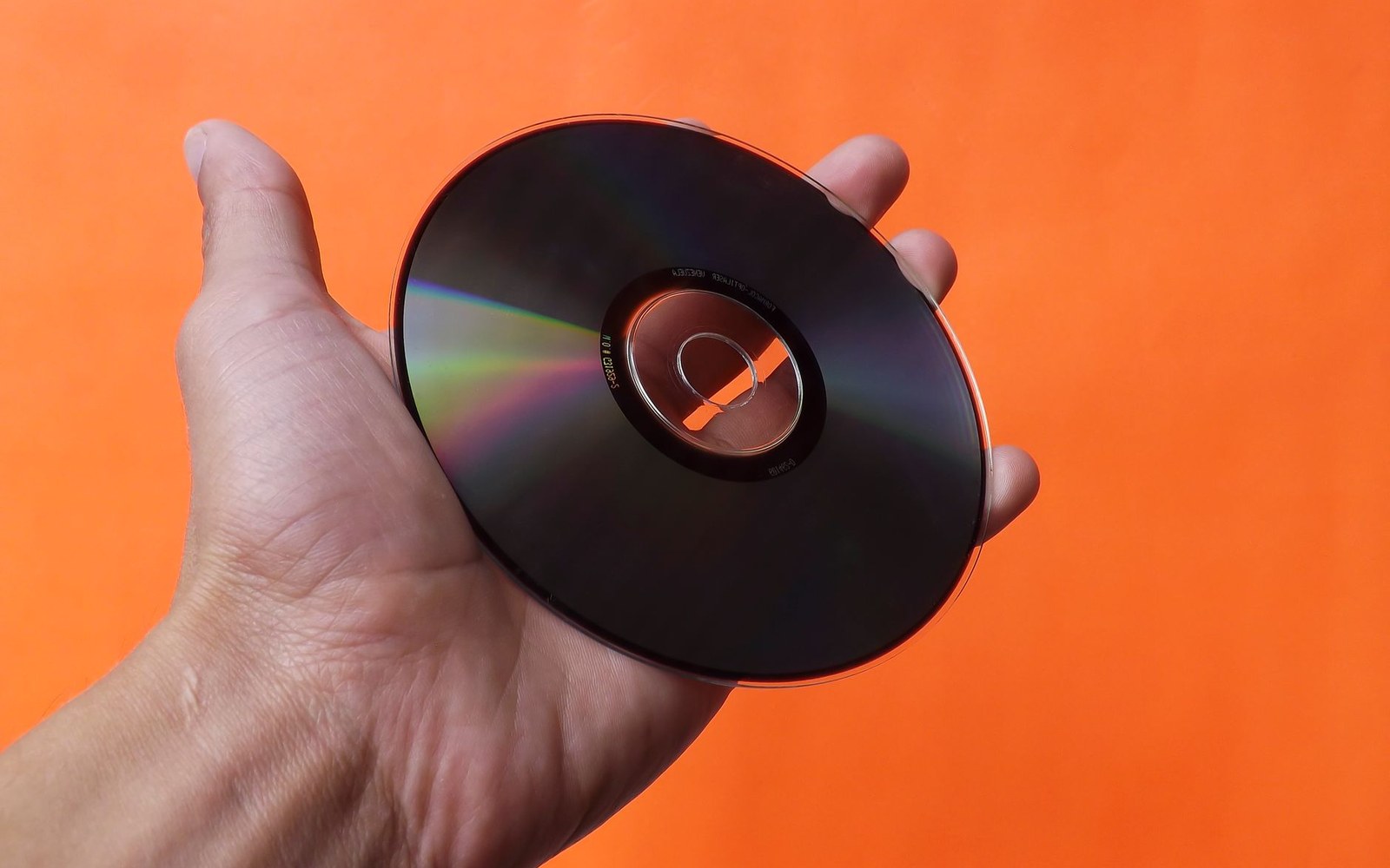 An old shareware CD-ROM sleeve — a 1990s compilation disc — shot flat on a light surface as a period object, the printed cover art and 'shareware' label clearly visible